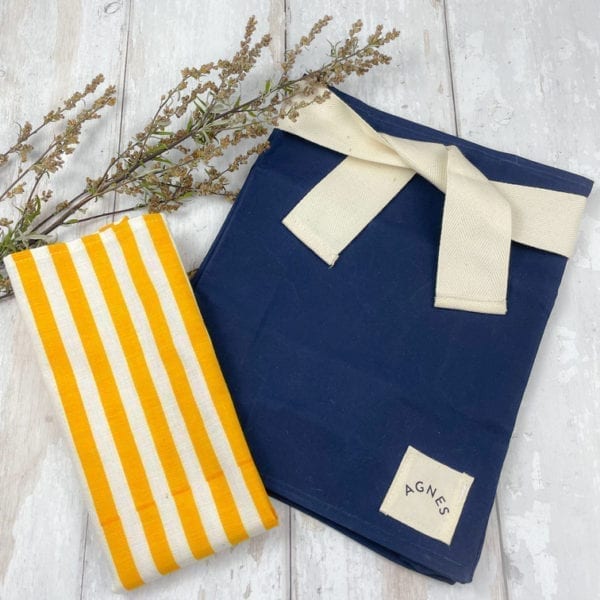 A picture of the navy oilskin lunch bag and cotton napkin