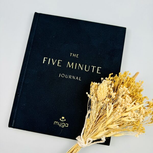 A picture of the Five Minute Journal included in the Yoga Wellness Gift Box.