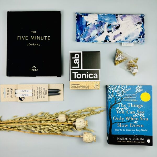 A picture of the range of gifts for mindfulness that are included in the Slow Down Gift Box