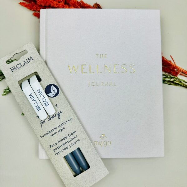 A picture of the Wellness Journal and Vent Reclaim Black pens that are included in the Yoga Wellness Gift Hamper