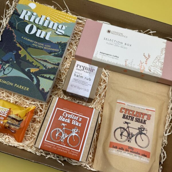 A picture of the selection of gifts for cyclist that are part of the Ultimate Cycling Gift Box presented in MindFill Packaging