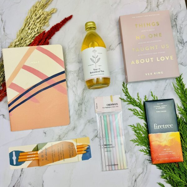 A picture of a wellbeing gift for her that shows the range of products that are included in the Positivity & Self-Care Box