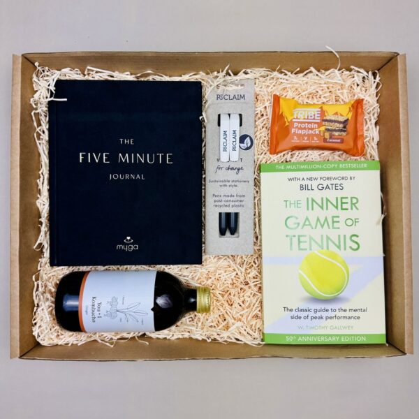 A picture of a tennis gift and all of the products that are included in the Mindful Tennis Performance Box and presented in MindFill packaging.