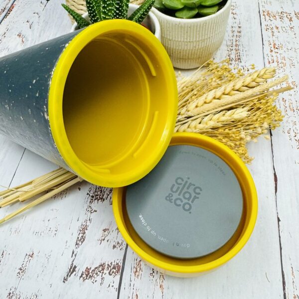 A picture of the Circular and Co travel mug with lid opened that is included in the Swim Wild Gift Box