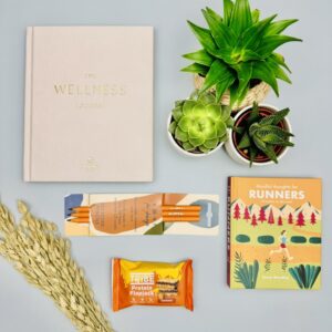 A picture of the runner gift and prodcuts that are included in the Run Well Gift Box