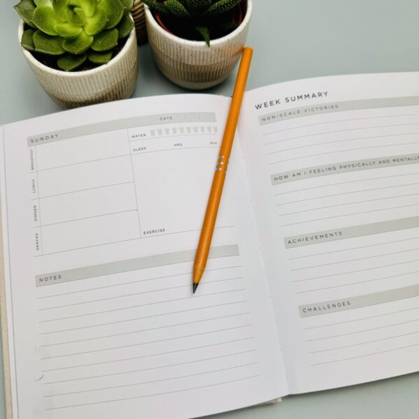 A picture of the inside page of Myga Wellness journal that is included in the Run Well Gift Box