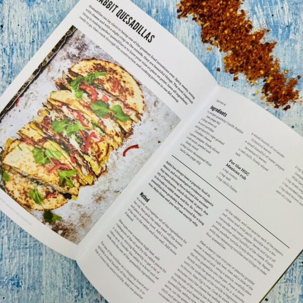A picture of the inside of the Hunter Gather Cook Book that is inlcuded inthe Fire & Food Adventure Gift Box